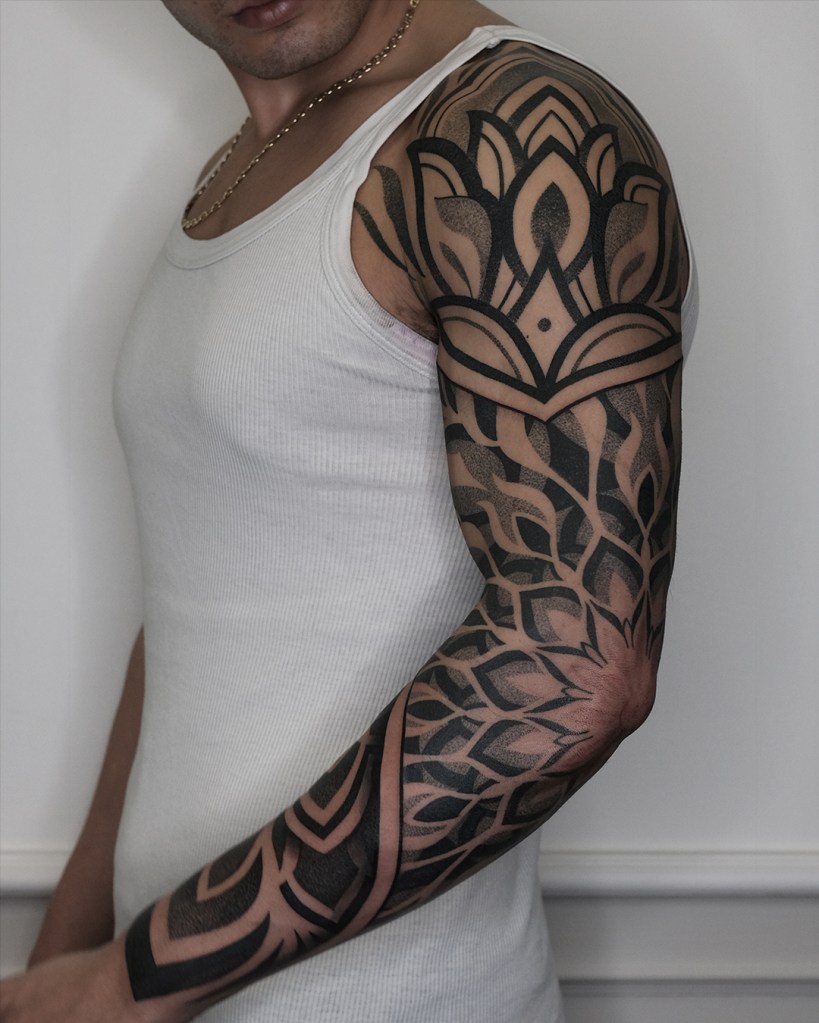 Big dotwork mandala tattoo on a fullsleeve